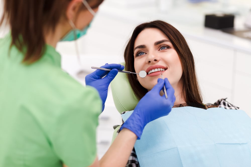 Woman receiving composite dental treatment