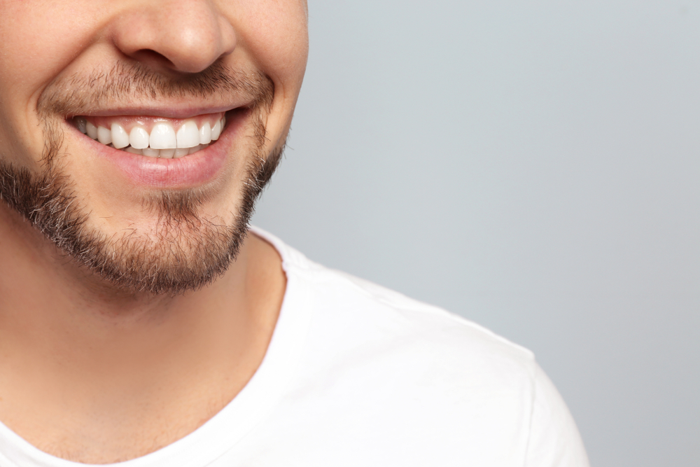 a bearded man smiling